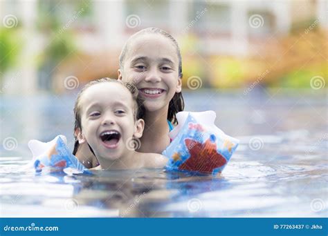 Happy Girl And Boy Enjoying In Swimming Pool Stock Image Image Of