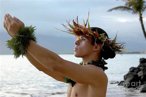 Male Hula Dance Performs On The Beach With Expressive Hand Movements