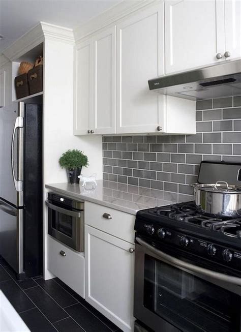 The charcoal glass backsplash completes the dark look. 40+ Beautiful Grey Kitchen Backsplash Ideas
