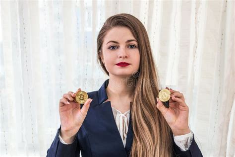 Attractive Young Woman Showing Golden Bitcoins Cryptocurrency Stock