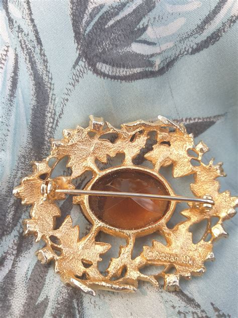 Sarah Coventry Gold Tone Brooch With Amber Rhinestones