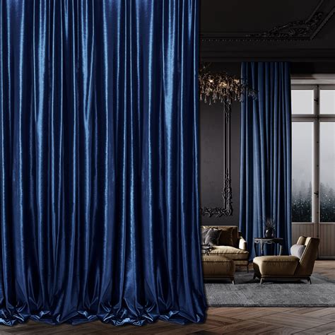 A Living Room Filled With Furniture And Blue Curtains