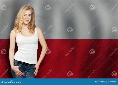 Cute Blonde Young Woman On The Poland Flag Background Travel And Learn