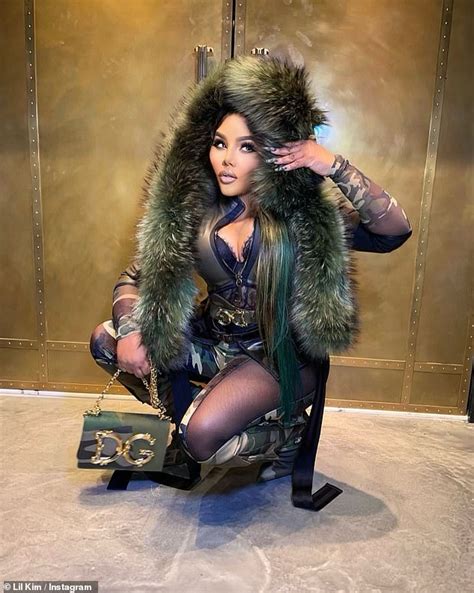 Lil Kim Puts On A Busty Display In A Sexy Camouflage Ensemble With A Green Fur Trim Daily