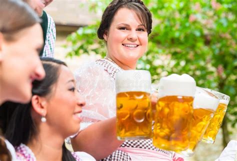 Waitress Serving Beer In Beer Garden Stock Photo Image Of Bavaria