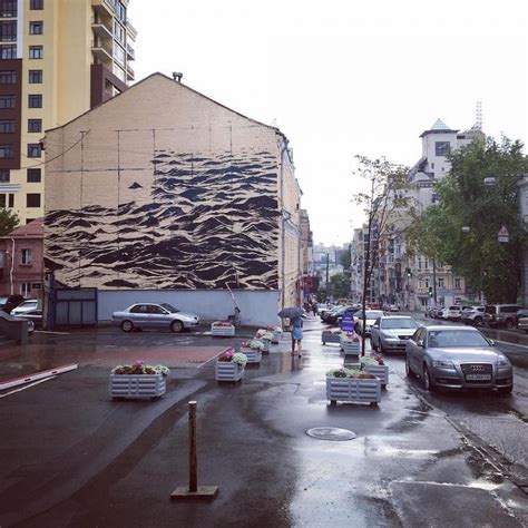 Sea Wall Dark Multi Story Mural Shows Stormy Waters On City Streets