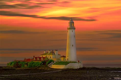 Download Yellow Orange Color Sunset Sky Man Made Lighthouse Hd Wallpaper