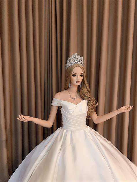 Ball gown wedding dresses are usually used for grander and larger wedding ceremonies. Minimalist white plain off the shoulder satin ball gown ...