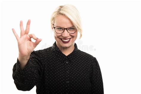 Young Blonde Female Teacher Wearing Glasses Showing Ok Gesture Stock