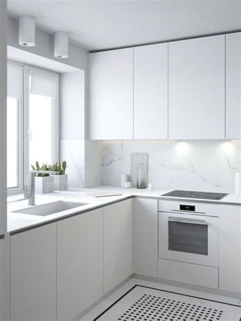 The pristine white doors hide some of the appliances, as well as a sizable pantry. Outstanding 20+ Incredible Small White Kitchen Design ...
