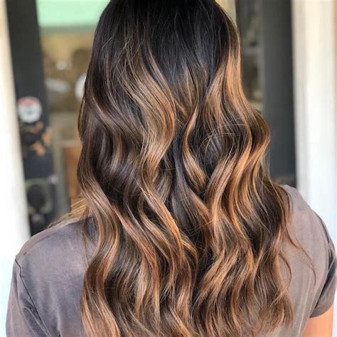 Black and dark brown hair alike look radiant and lighter when mixed with charcoal highlights. How to Add Highlights to Dark Brown Hair | Wella Professionals