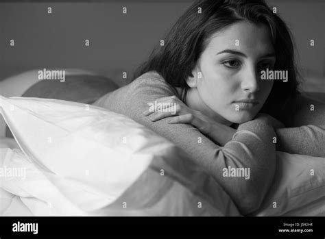 Woman On Bed Sad Black And White Stock Photos Images Alamy