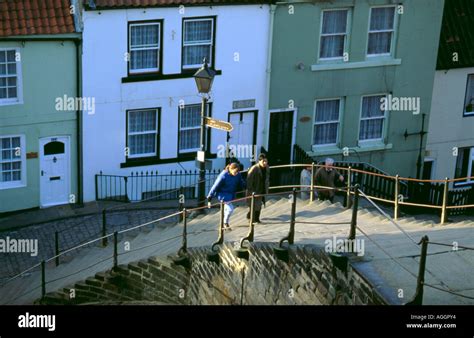 Couple Ascending The East Cliffs Flight Of 199 Steps Whitby North