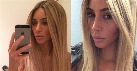 Nobodys Looking At Your Hair Kim Kardashian Pops Out Of Nude Top In