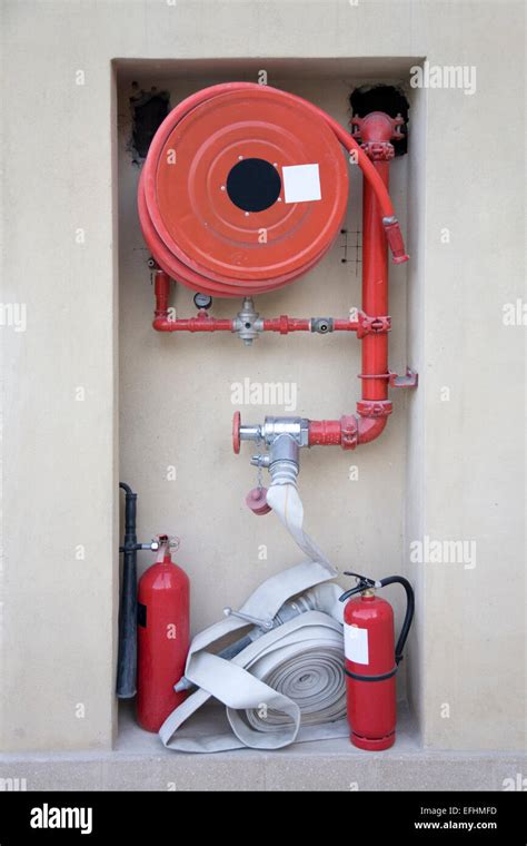 Firefighting Equipment Hose Reel And Fire Extinguishers At An