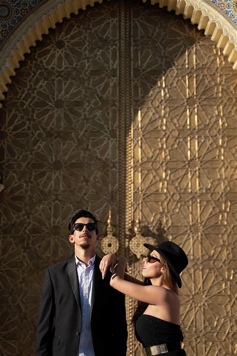 Moroccan Man With Sunglasses And Suit Together A Beautiful Woman Photograph By Cavan Images