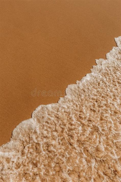 Top View Of Foam Waves Hitting A Sandy Seashore Stock Image Image Of