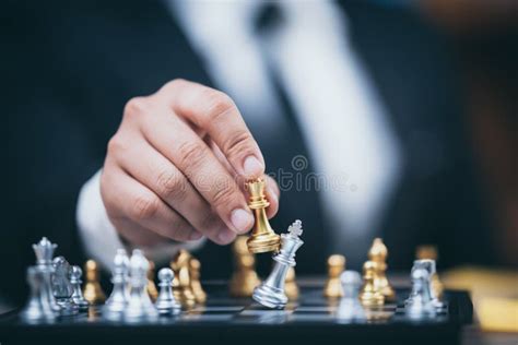Hand Of Businessman Moving Chess Figure In Competition Success Play