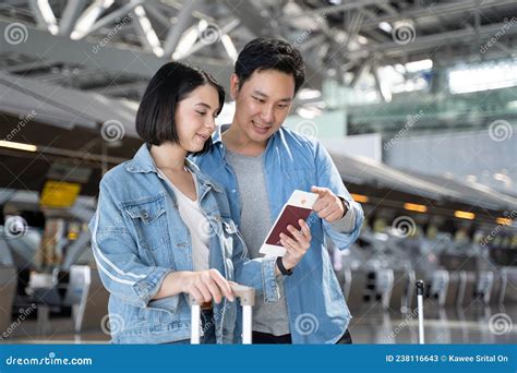Asian Young New Marriage Couple Passengers Walking In Airport Terminal