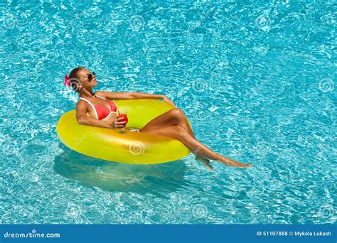 Woman In Bikini Enjoying Summer Sun And Tanning During Holidays In Pool