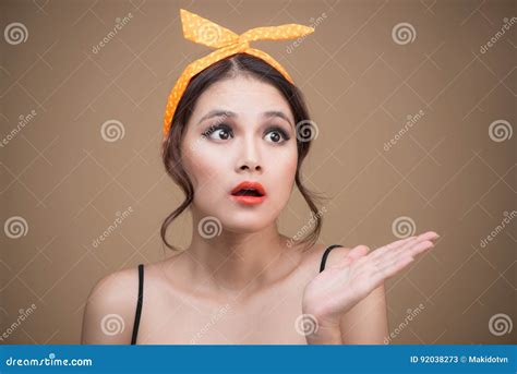 surprised asian girl with pretty smile in pinup style on yellow stock image image of beautiful
