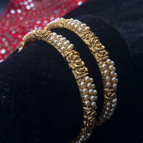 Golden Bangles With Intricate Design And Moti Set Of 2