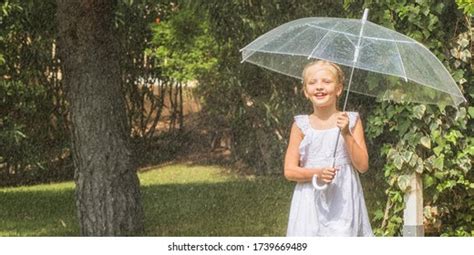 Little Girl Umbrella Playing Rain Stock Photo 1739669489 Shutterstock