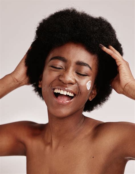 Skincare Beauty And Black Woman With Afro And Cream On Face Smile And