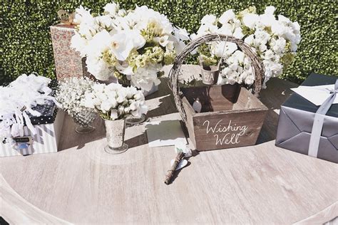 Your guests will more than likely come to the wedding bearing gifts, so it should go without question that a gift table definitely needs a place in your overall wedding day décor. Reception Décor Photos - Wedding Gift Table - Inside Weddings