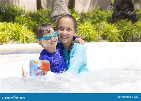 Happy Girl And Boy Enjoying In Swimming Pool Stock Image Image Of