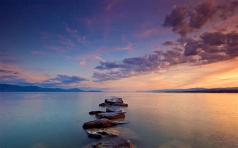 Stones On Body Of Water During Sunset Hd Wallpaper Wallpaper Flare