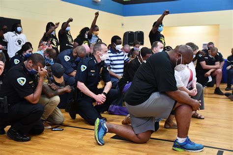Police, elected leaders take a knee, draw protests | Madison365