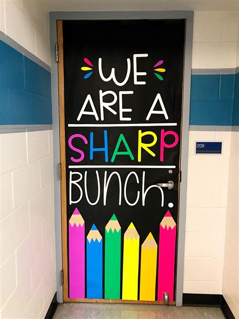 A Classroom Door Decorated With Chalk And Crayons That Says We Are A