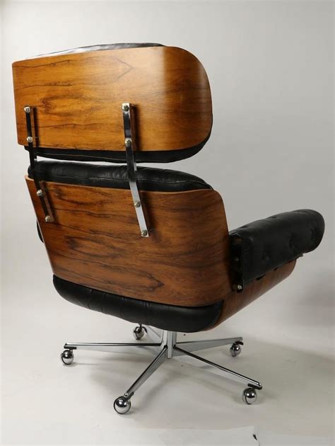 Everyone wanted to be seen with the eames lounge chair & ottoman, including this well known double page advert for this major brand in the 1950's Rosewood and Leather Eames Style Swivel Lounge Chair and ...