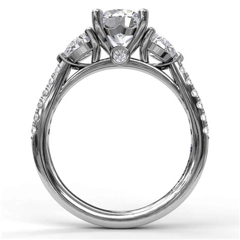 Three Stone Engagement Ring Set In Platinum With Pear Cut Side Stones