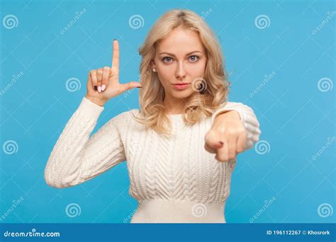 Grumpy Disrespectful Woman With Blond Hair Showing Loser Gesture And