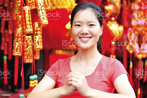 Young Asian Woman Wishing You A Happy Chinese New Year Stock Photo