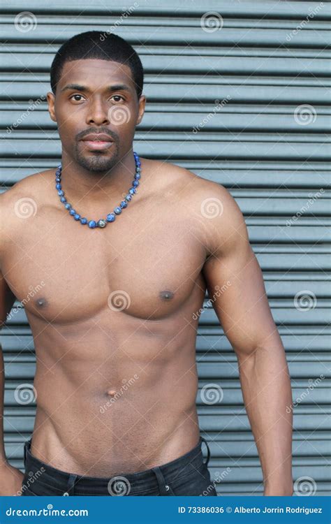 Strong Fit And Sporty Stripper African Man Over Metallic Background