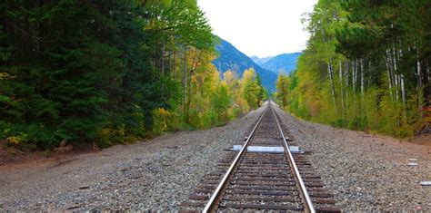 Railroad In The Fall Forest With Mountains Stock Photo Image Of