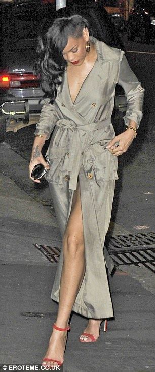 Rihanna Raises Eyebrows As She Steps Out In A Mackintosh And Little
