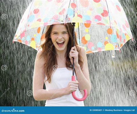 Teenage Girl Sheltering From Rain Beneath Umbrella Stock Image Image