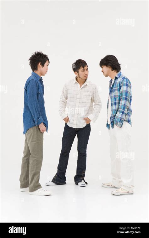 Three Young Men Glaring At Each Other Stock Photo Alamy