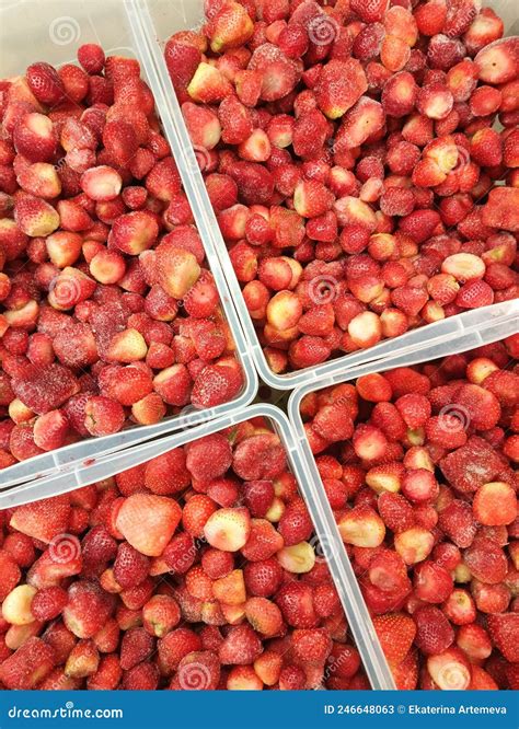Lots Of Frozen Strawberries In Clear Plastic Containers View From