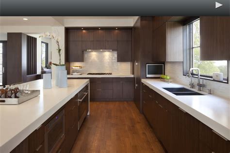 Quartz countertops remain hugely popular but you should know the pros and cons of quartz countertops. White quartz countertop with dark cabinets. Modern. | Walnut kitchen, Kitchen design, Modern ...
