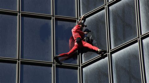 French Spiderman Alain Robert Climbs 613ft Skyscraper To Mark 60th