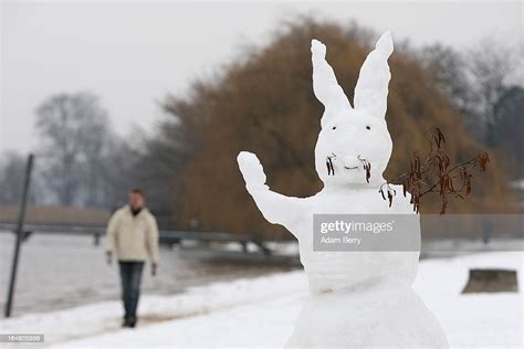 An Easter Bunny Shaped Snowman Stands On The Snow Covered Strandbad