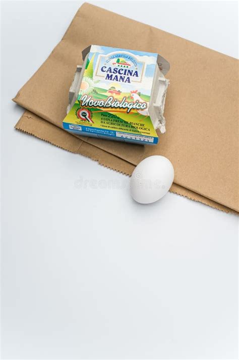 Cardboard Egg Box And White Fresh Eggs On A White Tabletop Backg