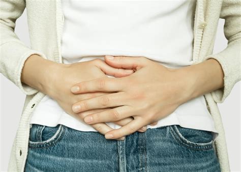 Premium Photo Woman Holding Her Stomach Feeling Pain During Period