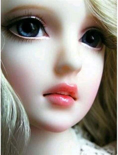 A Doll With Blonde Hair And Blue Eyes