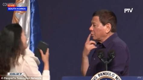 Phillipine President Rodrigo Duterte Kisses Filipino Worker On Stage